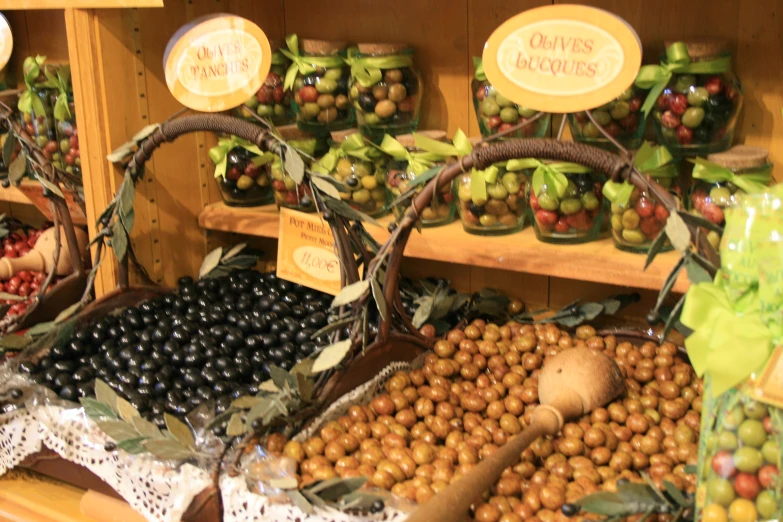 a produce stand at a grocery store filled with fruits