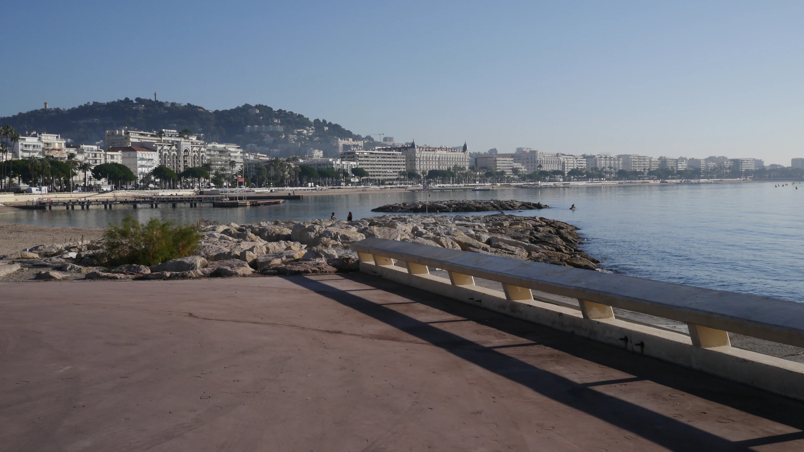 a large body of water next to a city