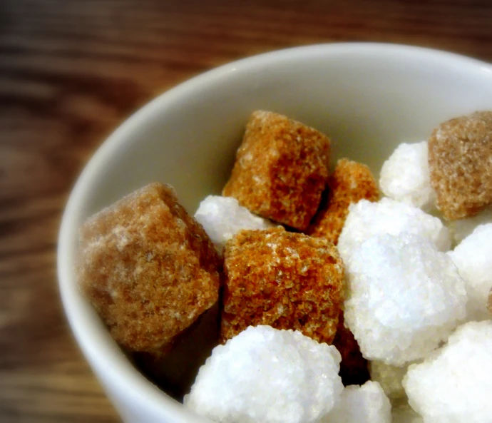 small sugar cubes and marshmallows are in a bowl