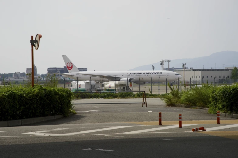 a large jetliner sitting on top of an airport runway