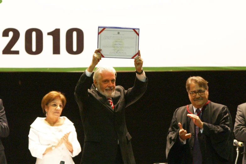 a man and women holding up an award