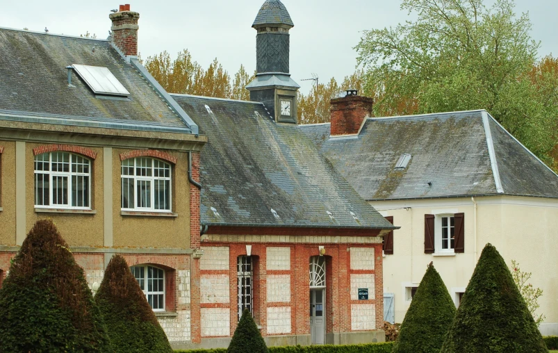 a house with a clock tower in the background