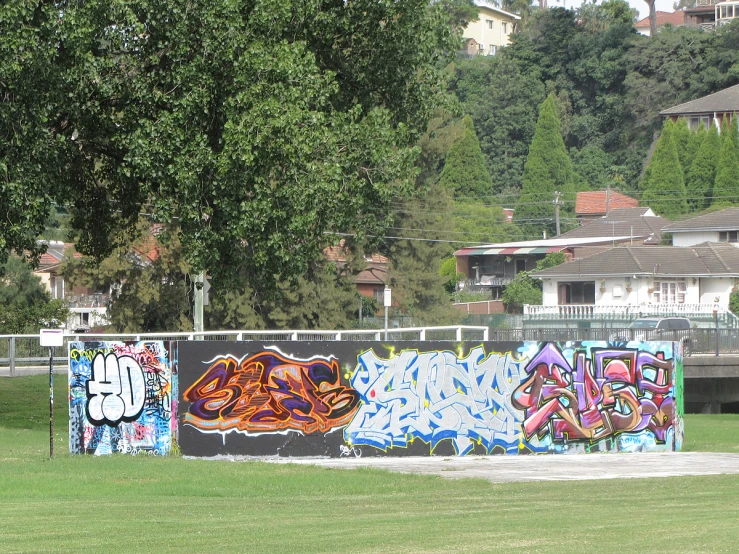 there are many graffiti covered walls along the street