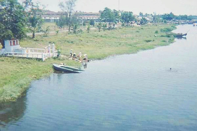 a boat on the water in the countryside