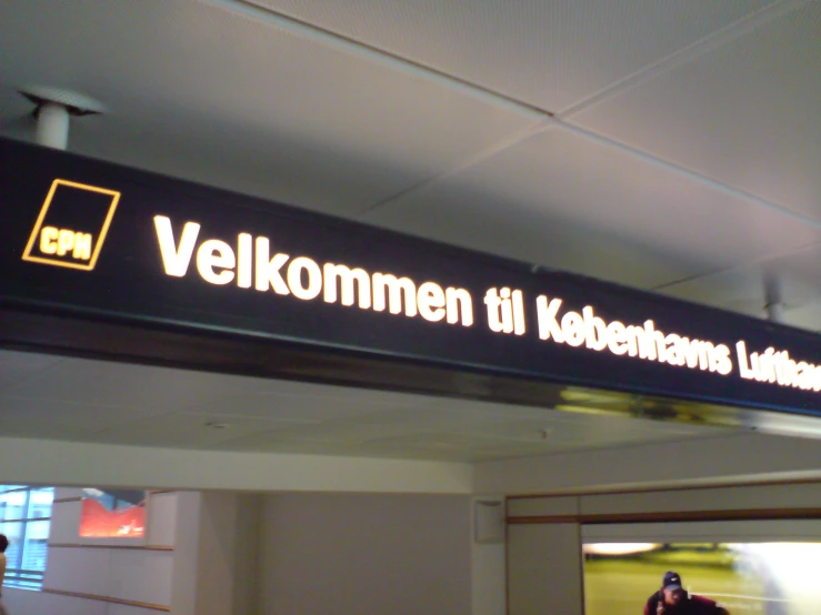 sign saying which is at the airport where we can see it