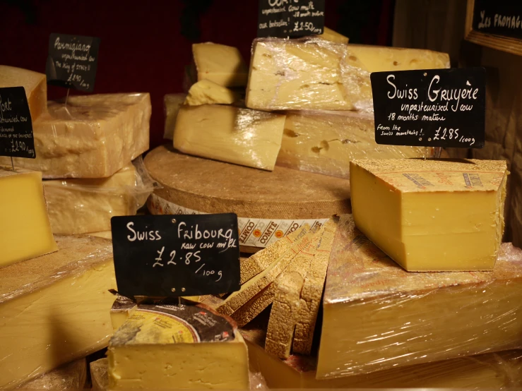 cheese and other items for sale at a market