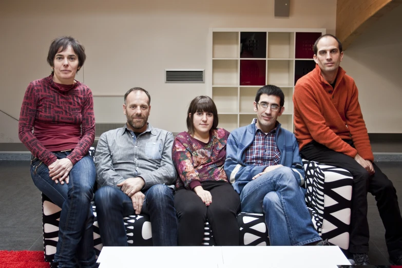 a group of people sitting on a bench