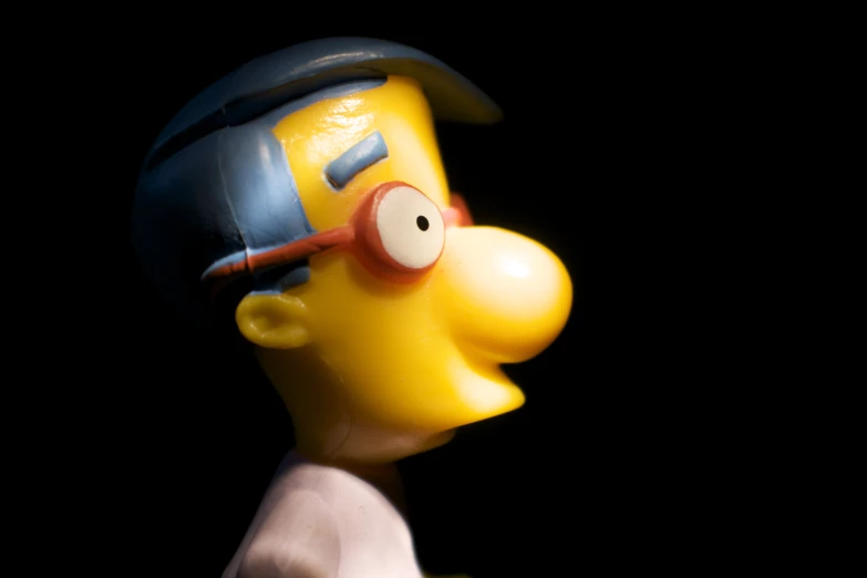 the simpsons with a helmet on and a cap