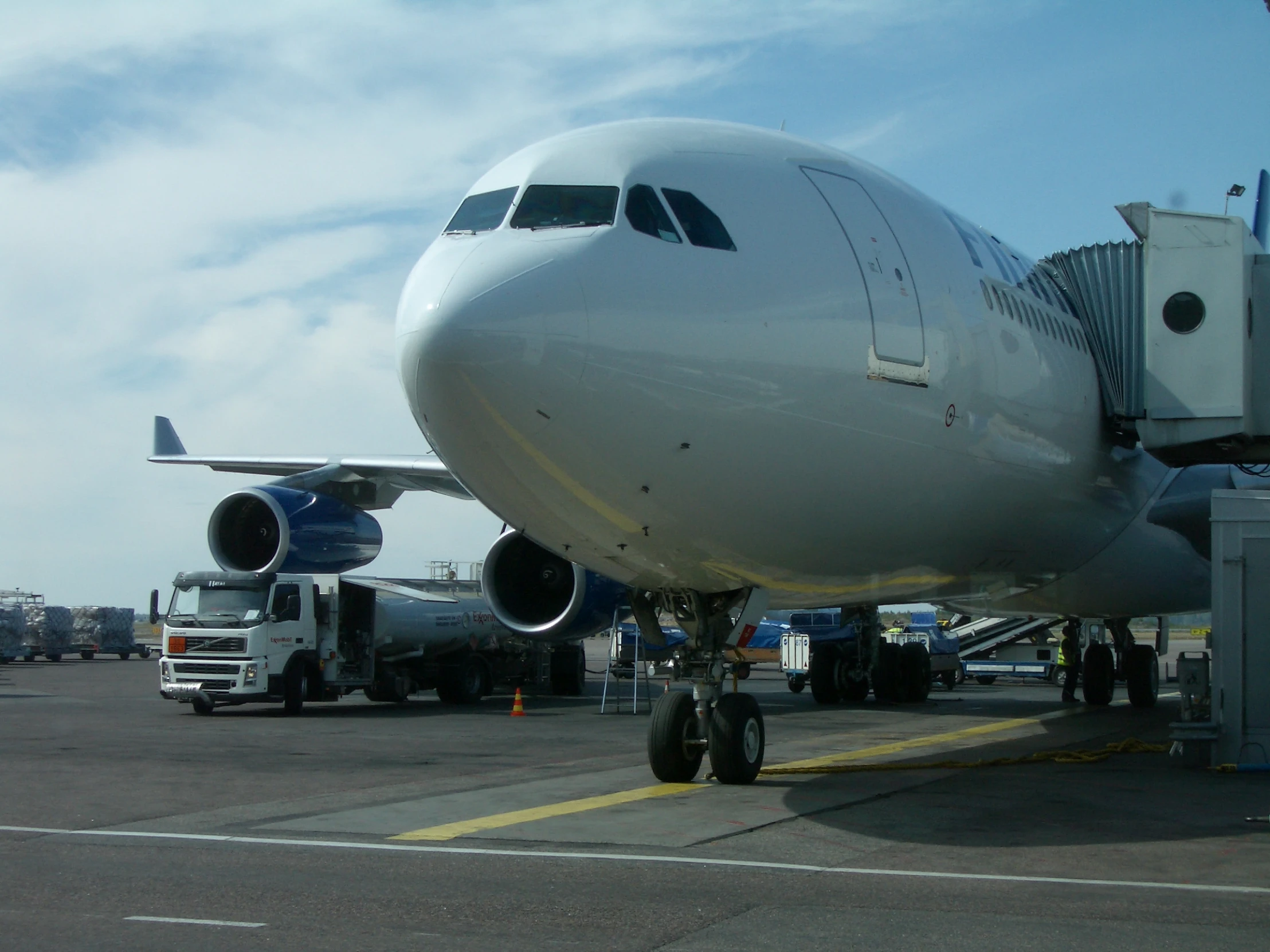 the jet airliner has a lot of large wheels