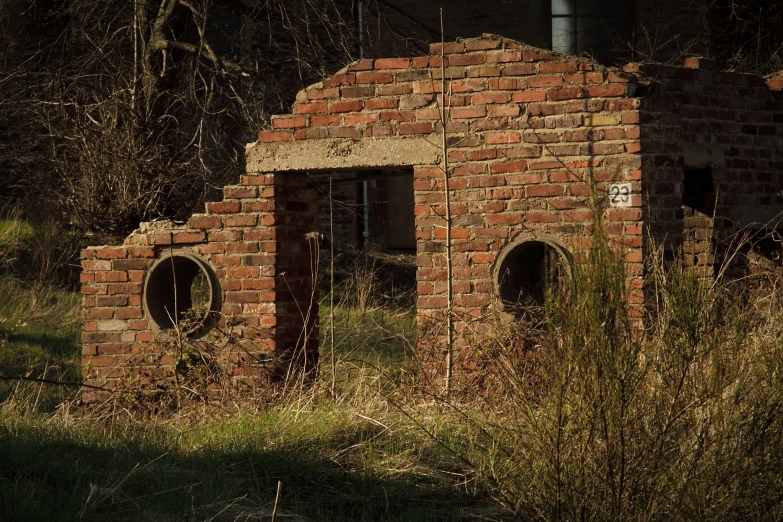 there is a brick structure with round windows