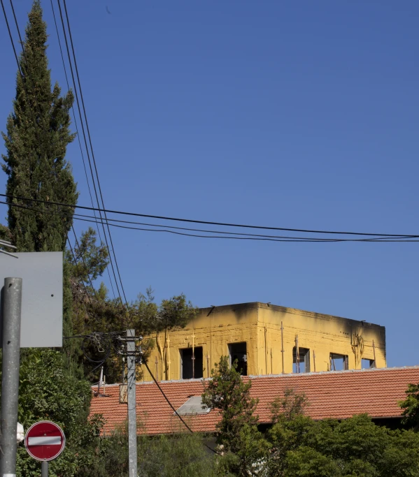 a construction site with red roof and brick buildings in the background