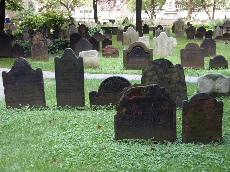 old cemetery with several headstones in the grass