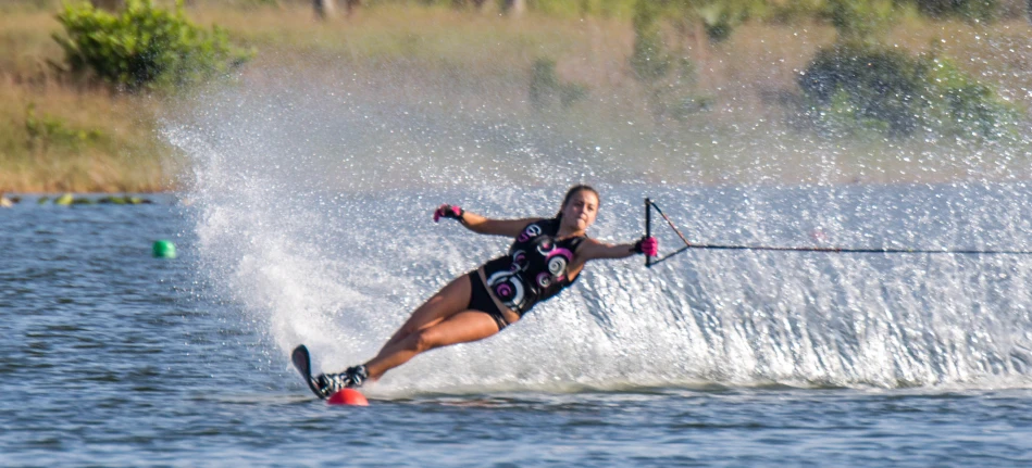 the woman is water skiing in the lake