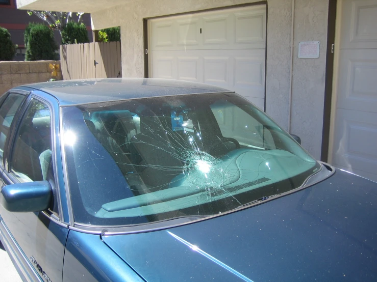 the side window of a car, with the shattered glass on