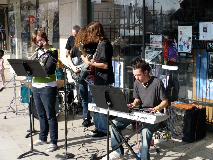 there is a band playing outside together