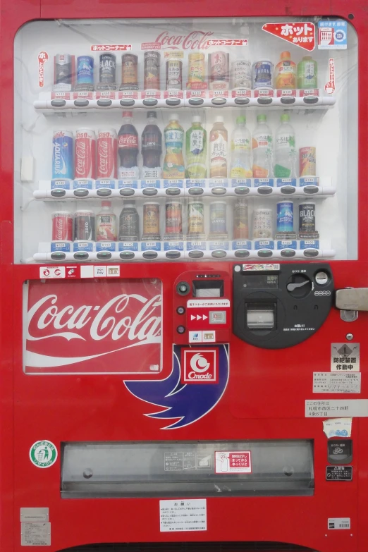 there is a coca cola machine with sodas