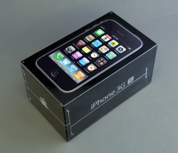 the iphone 5 box sits empty on the table