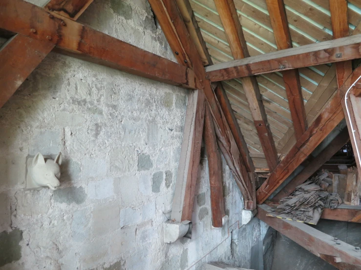 two windows above the sink in an unfinished room