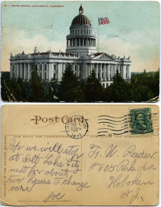 a postcard from the united states is displayed with an envelope and a stamp in front of the state capitol building