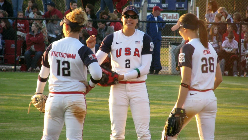 some baseball players on a field talking to each other