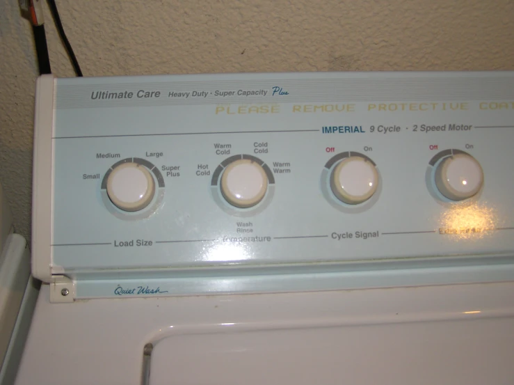 front of washing machine with control panel labeled