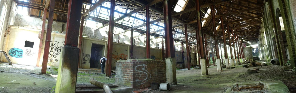 the interior of an abandoned building with graffiti