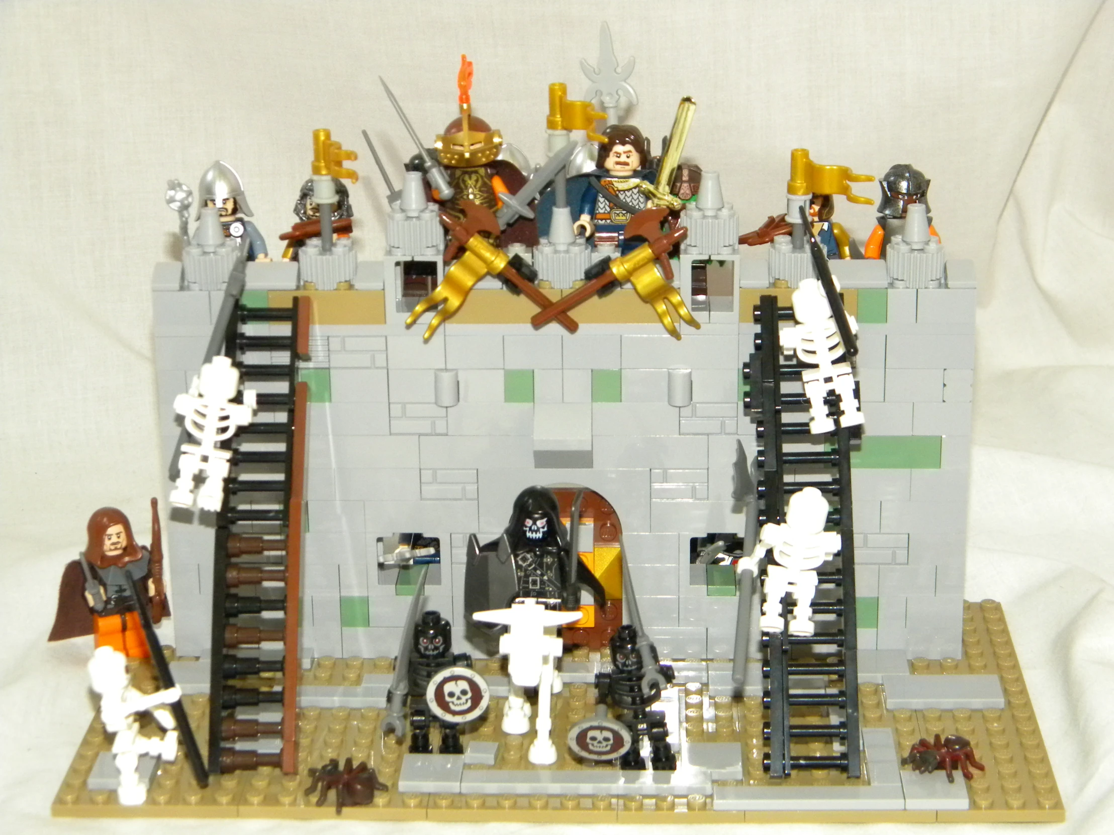 a lego castle with skeletons on it, stairs and knights