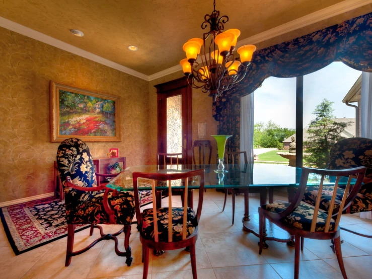 a room with some chairs and a rug on the floor