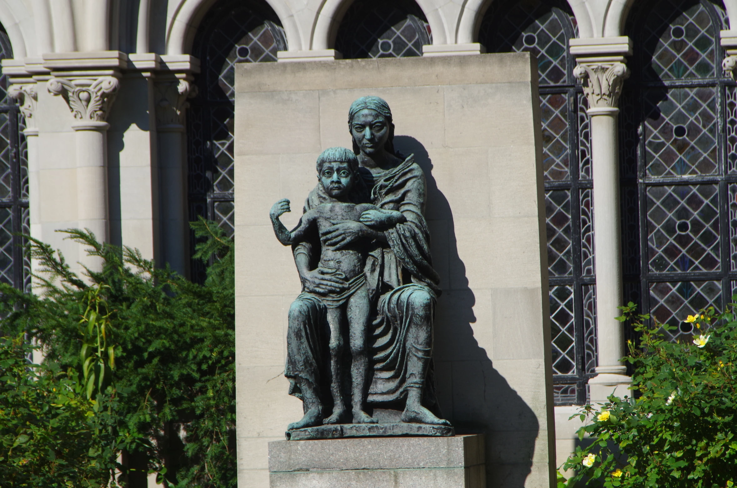 a statue of a man holding a child