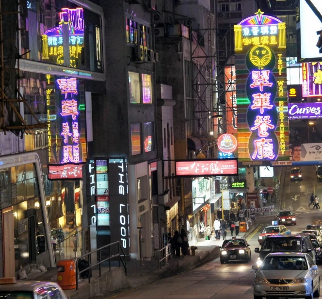 neon street signs on a night city street