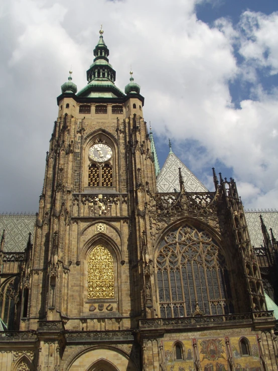 an elaborate clock tower on top of an old church