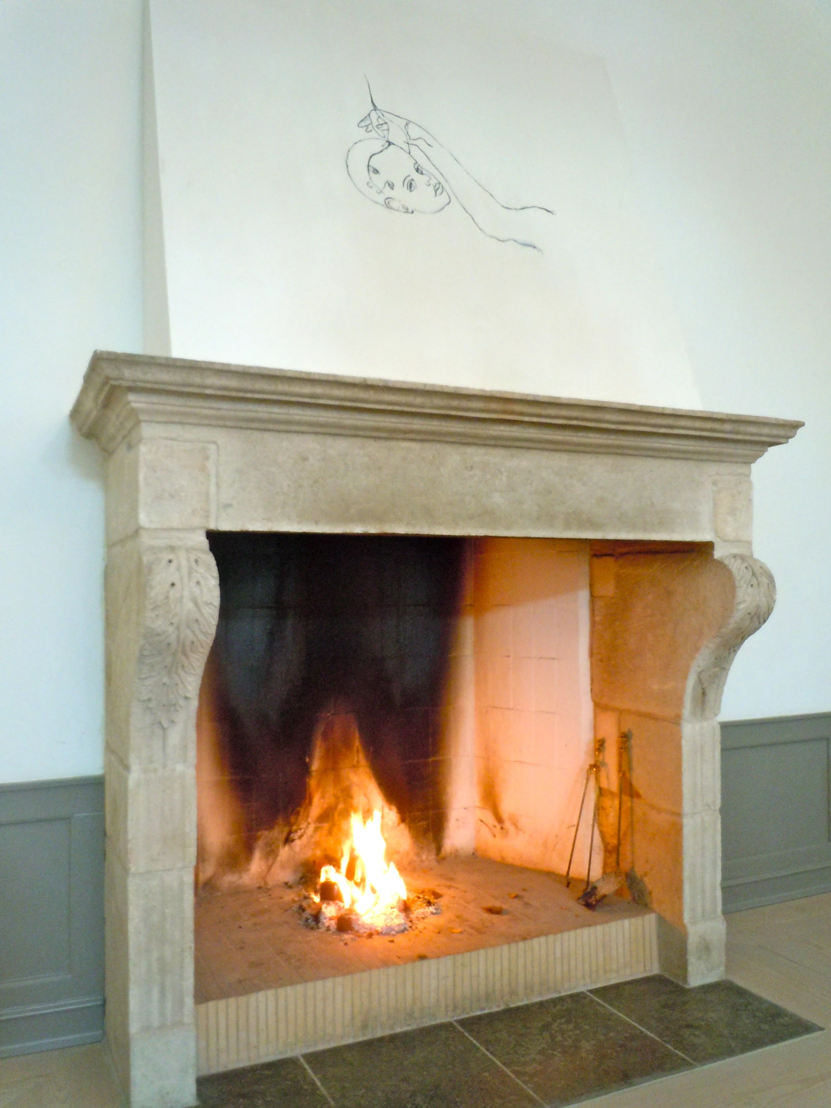 a fireplace with a lot of flames next to it