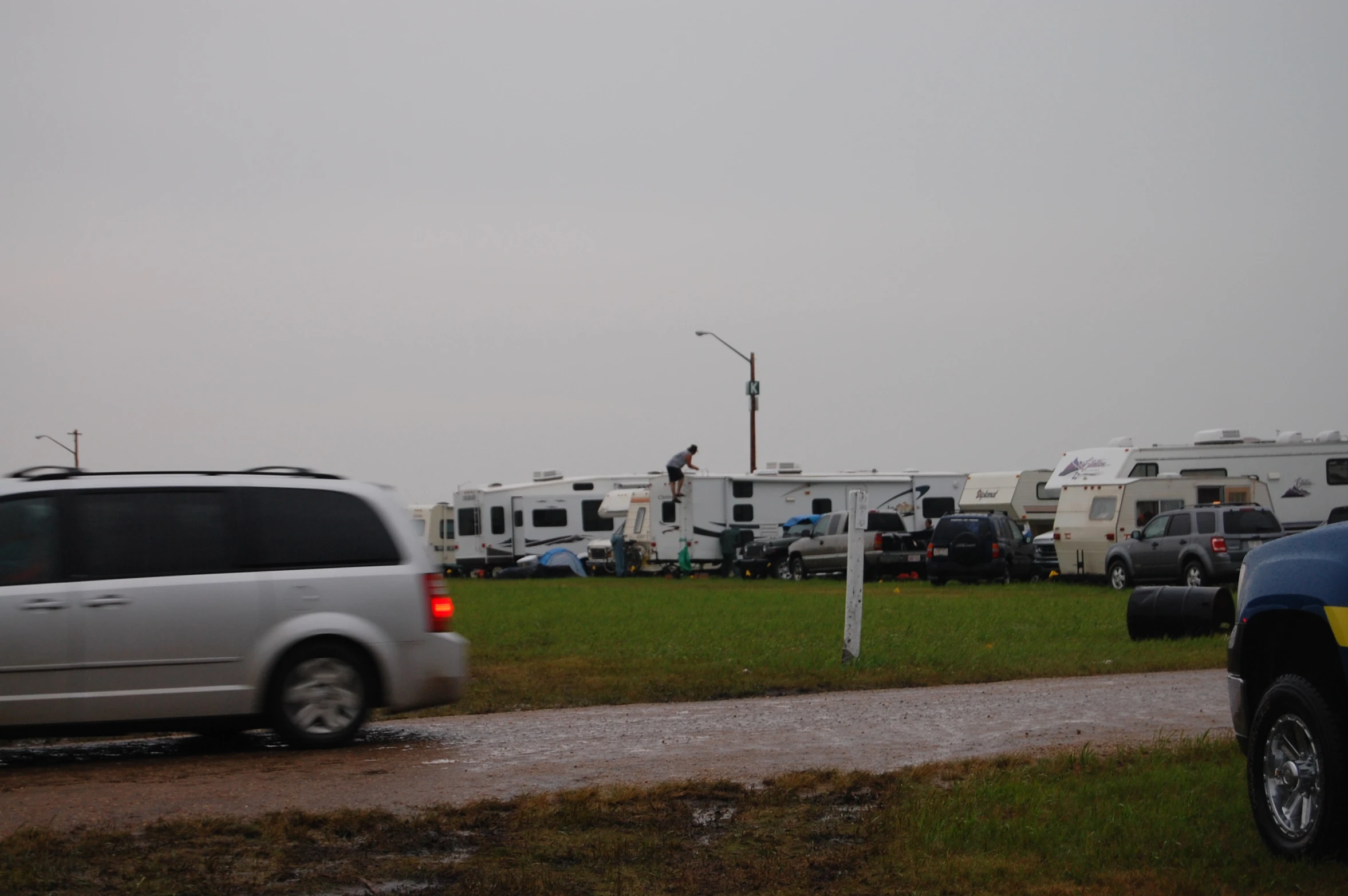 a group of rv parks and cars are parked