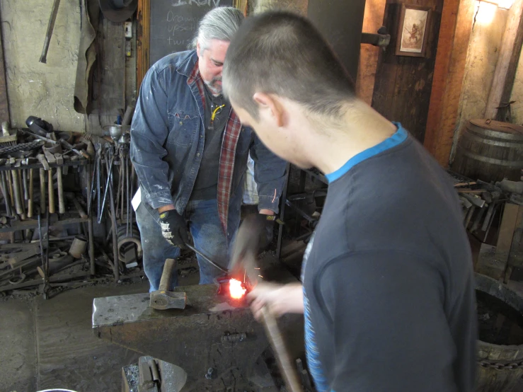 men working with tools in an old building