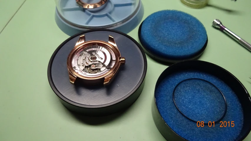 a table with a watch in its presentation box