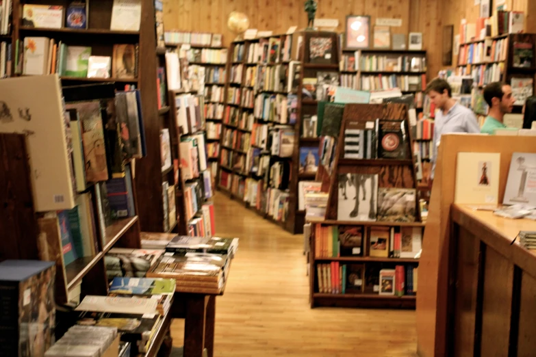 several bookstores are shown with men looking at them