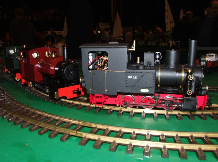 a small train on a miniature track at night