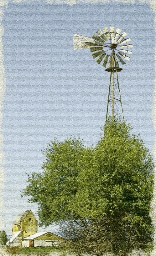 a white windmill in the distance and some trees