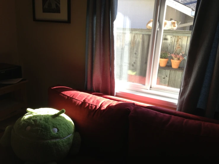 a stuffed animal next to a window