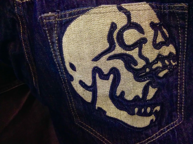 a pocketed piece of clothing with a skull face drawn on it