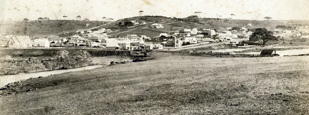 an old po of houses and hills, taken in the 1800s