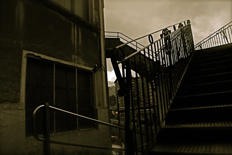 a set of stairs going up the side of a building