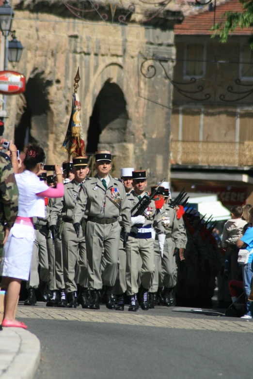 a man in uniform is standing on roller skates