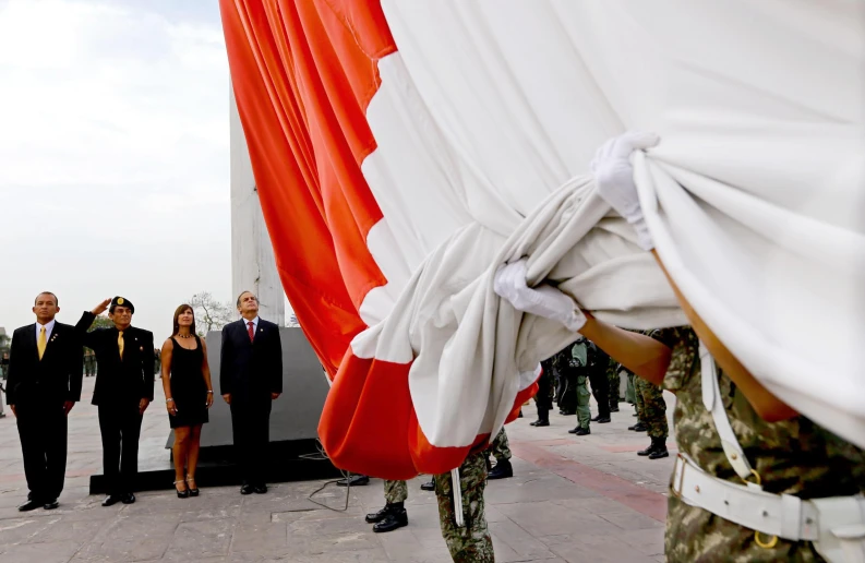 a soldier holding the american flag is shown in front of an image of the united states