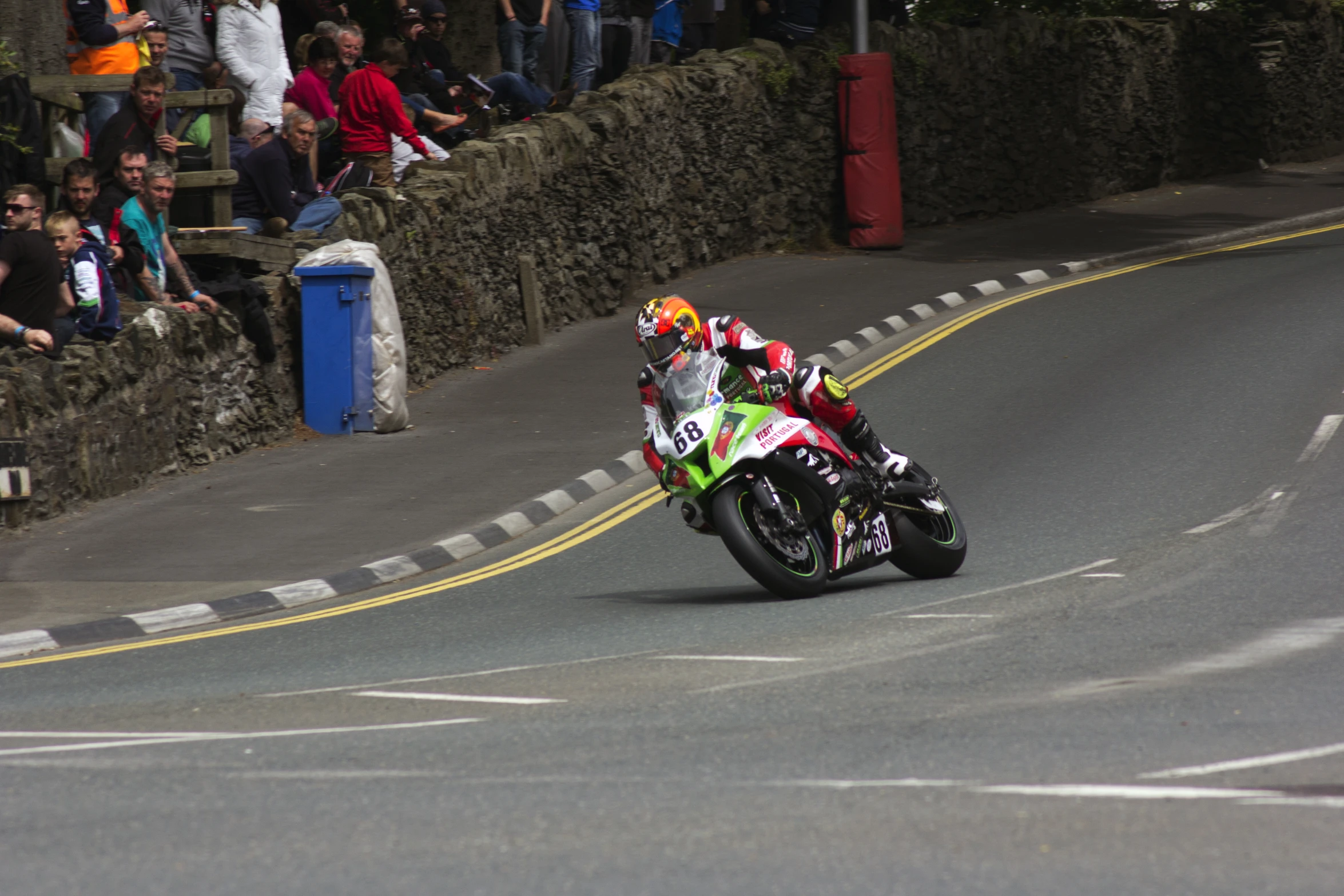 a man riding a motorcycle on the road