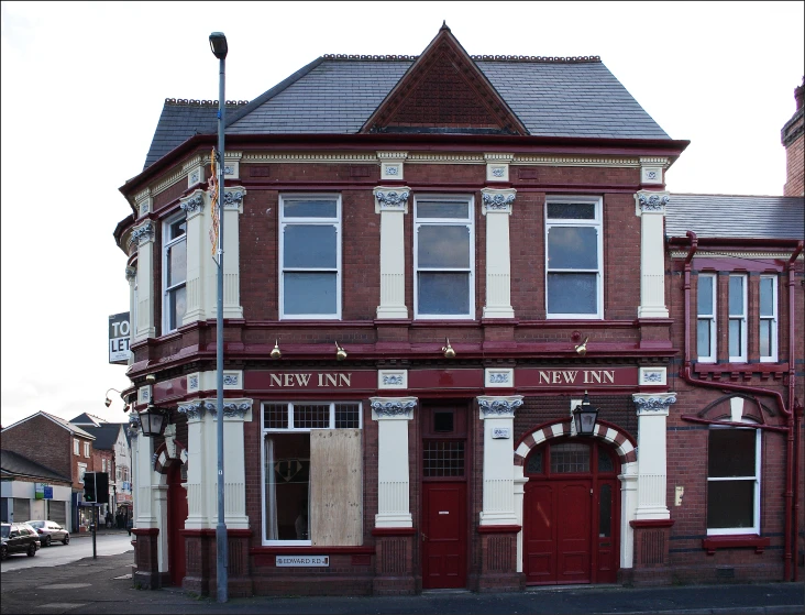 an old building on a corner in the town