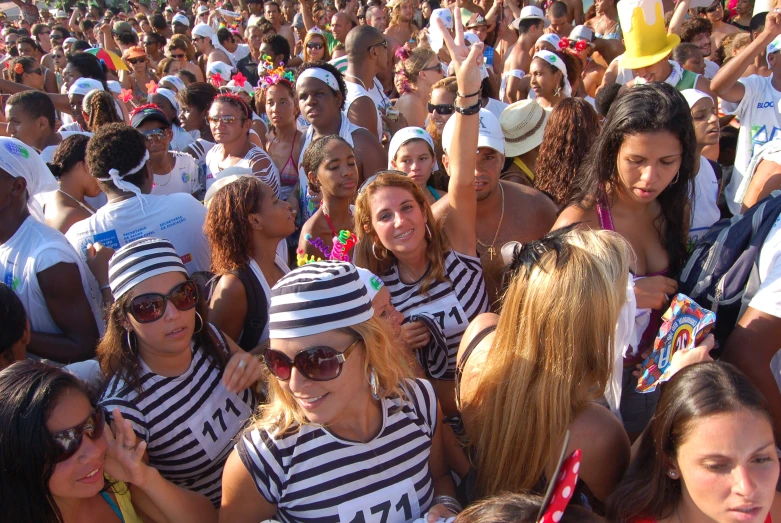 a large group of women standing together in a crowd