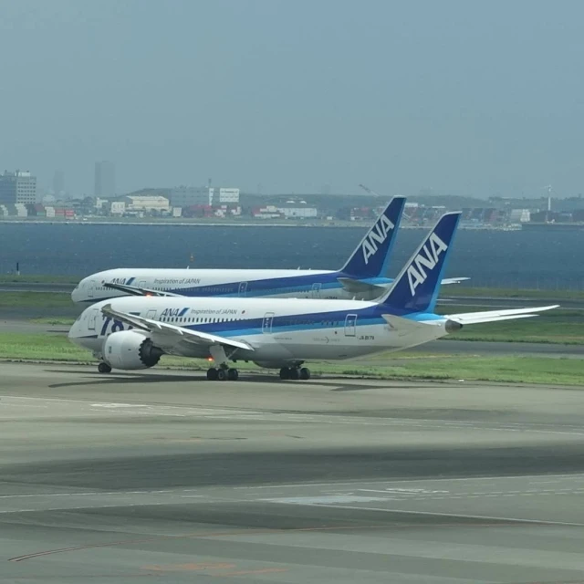 an airplane on a landing strip at an airport