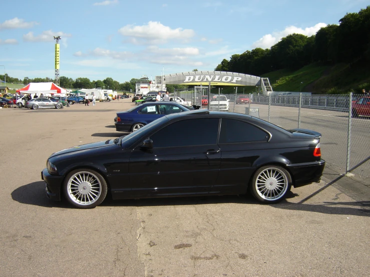 a black car with some chrome rims