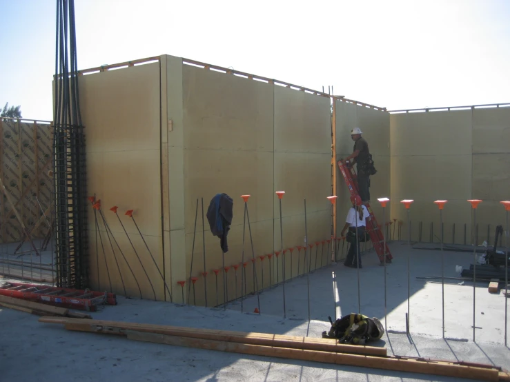 a group of people stand near construction walls